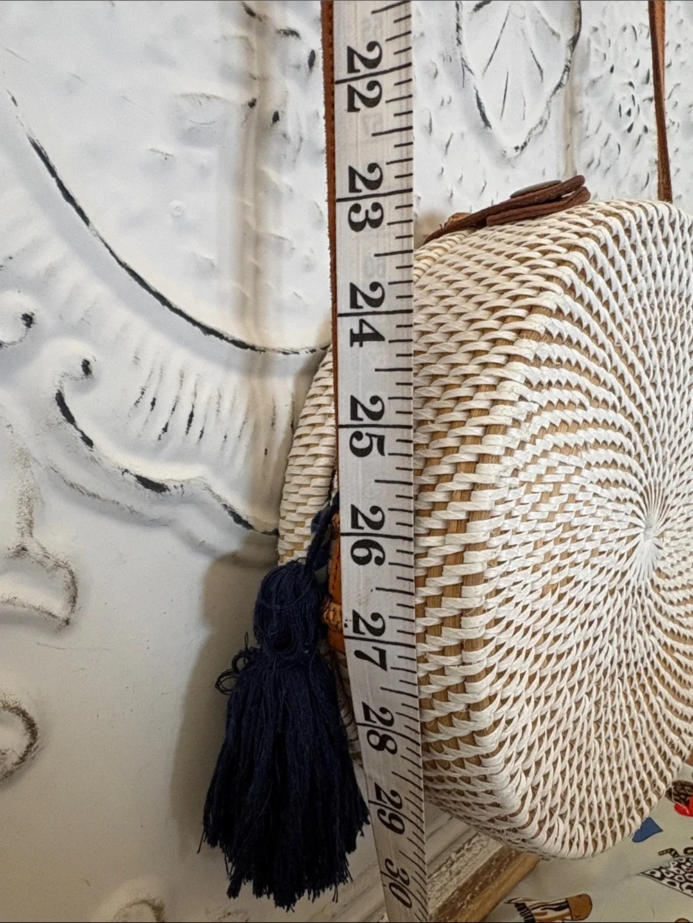 Round Woven Straw Crossbody Bag with Tan Strap and Navy Tassel